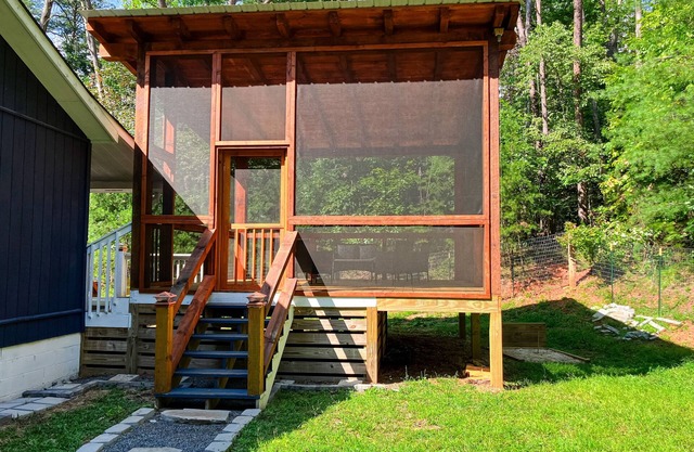 Quaint wooded escape with wraparound deck, firepit, & fast WiFi - dog-friendly