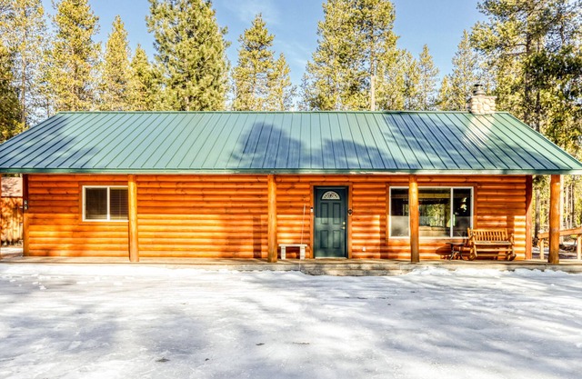 Quiet, dog-friendly cabin with wood fireplace, porches & lovely forest setting