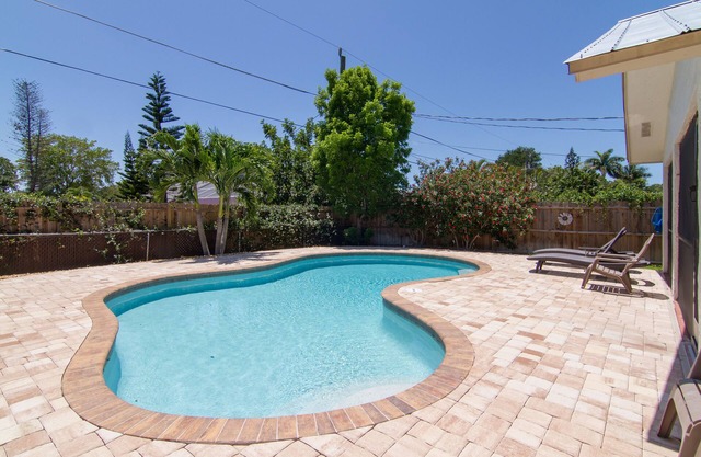 Relax by the sand at nearby Vanderbilt Beach or hang by heated pool