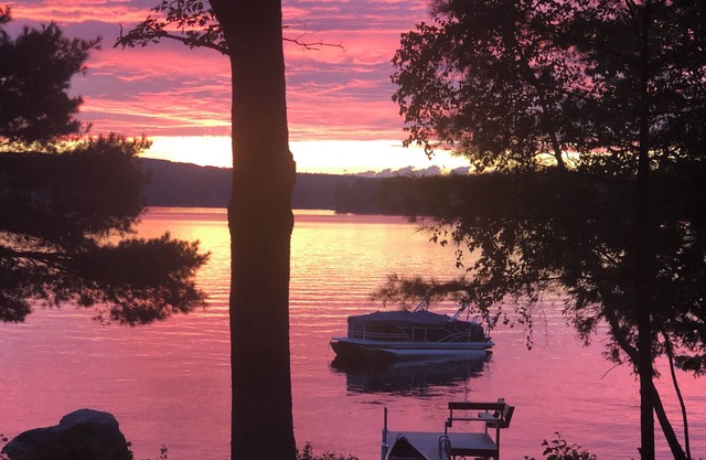 Relax in the glow of a campfire at this waterfront cottage on Thompson Lake