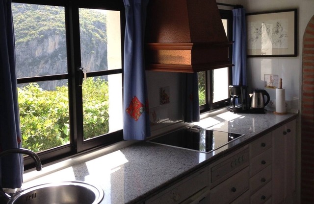 Romantic cottages with lovely pool, winding pathways amid lush tropical gardens.