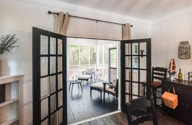 Secluded & exclusive home near downtown with marsh views & screened porch