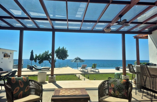Serene 4BR Oceanfront Villa with Large Saltwater Pool and Direct Sea Access