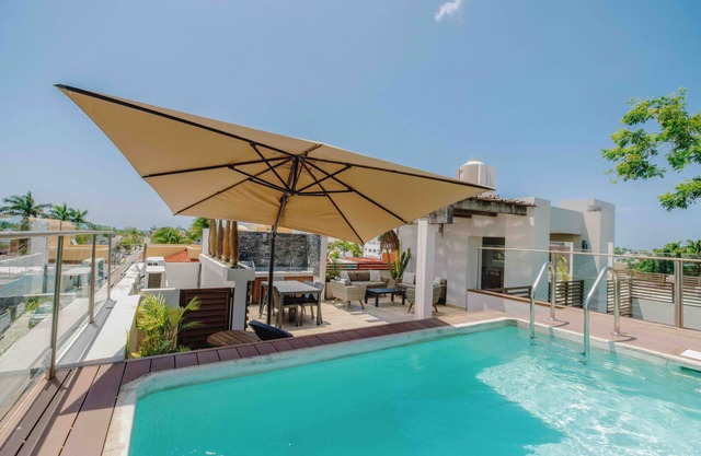 Serviced 1-Bedroom Apartment · Rooftop BBQ + Pool · Bikes · Security