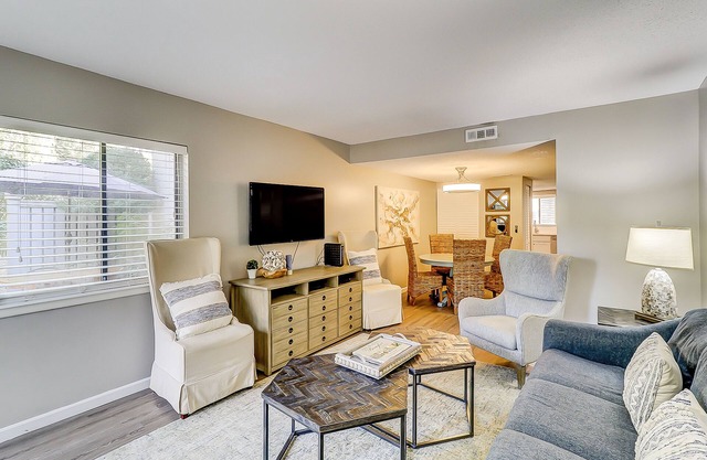 Snowbird/dog-friendly villa with WiFi, 2 patios, & grill + pool/beach access