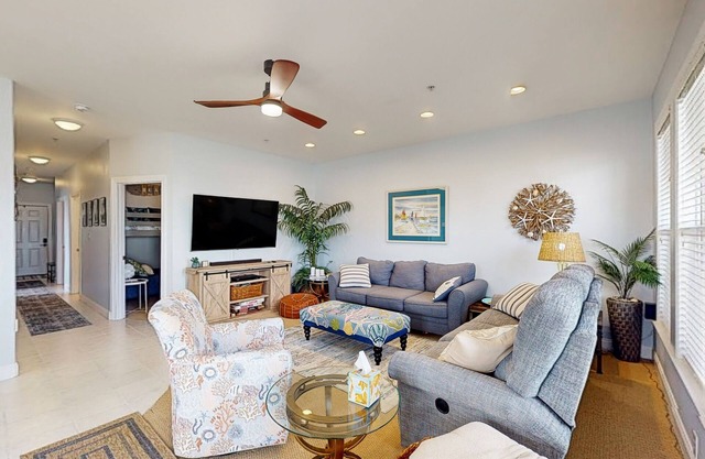 Sound side condo with sunset view balcony - close to pool, hot tub, and pier