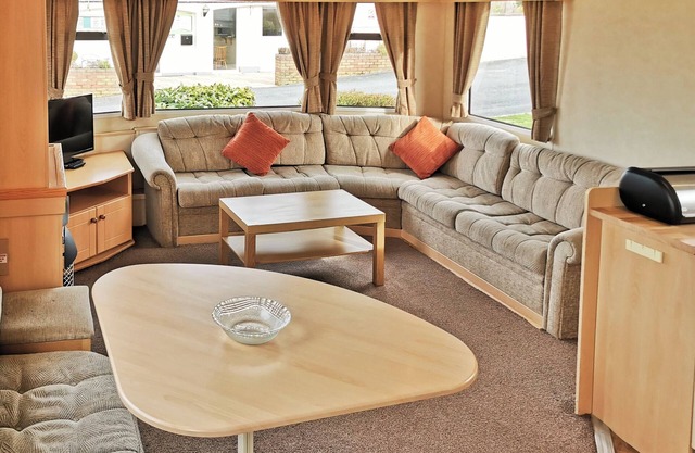 Spacious and comfortable 12ft-wide caravan with one double and two twin.