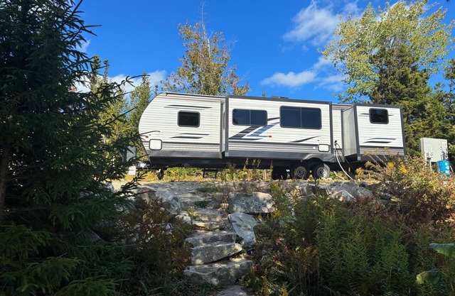 Starlight Beach Experience 31' RV Travel Trailer on private beach and firepit