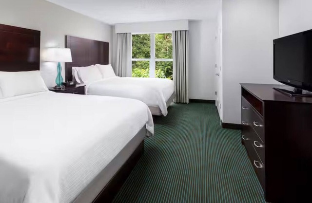 Stay Near Disney: 2 Resort Suites w/Pools, Free Shuttle & Breakfast