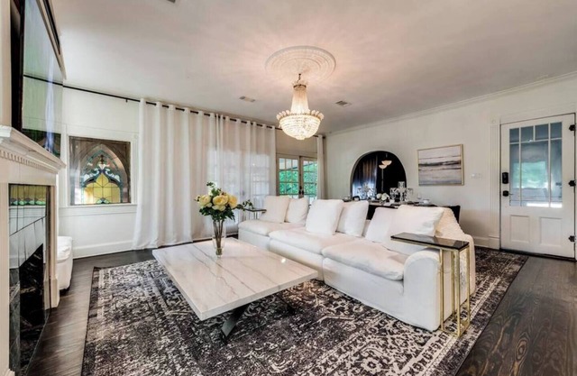 Step into Dallas elegance, where historic architecture meets modern luxury living just minutes from Downtown. Featuring soaring ceilings, crystal chandeliers, and a grand stone fireplace, this home blends timeless design with contemporary comfort.