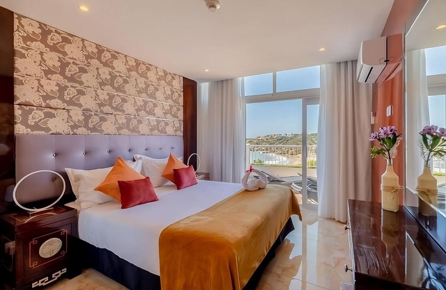 Steps Away from Oura Beach! 3 Family Suites, 2 Outdoor Pools, Free Parking!