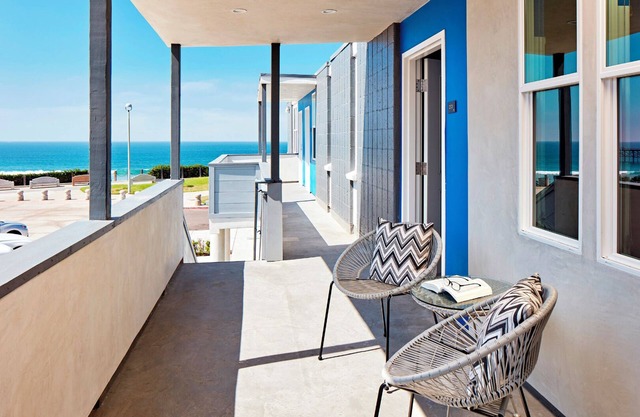 Steps from the Sand: Room with Ocean Panorama in Modern Setting