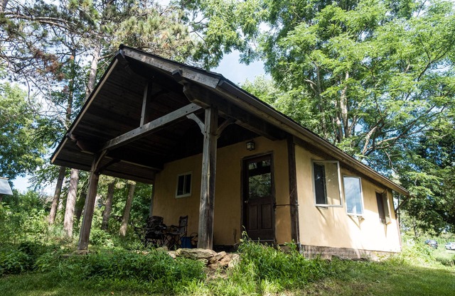Straw clay sauna house on organic farm