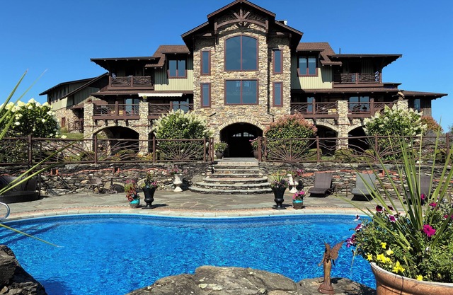 Stunning Modern Artistically Crafted Lodge. 50 pristine acres with 9ac pond/pool