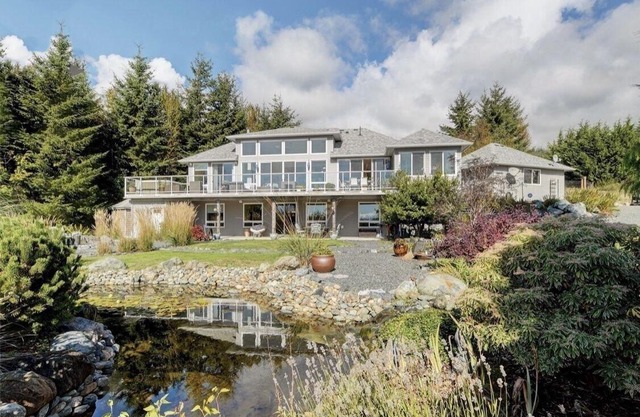 Stunning open style home set on 3 acres in the Seaside hamlet of Jordan River.