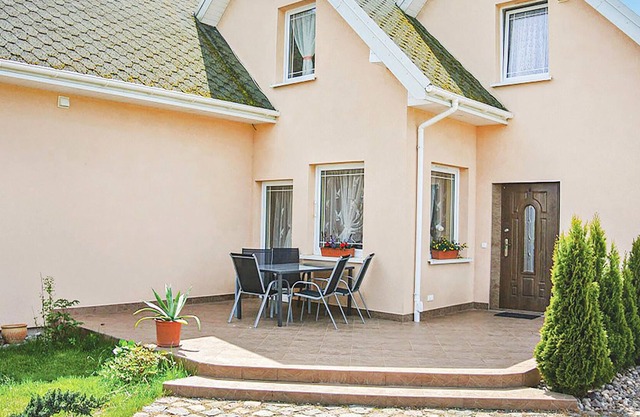The terraced house is located on large, fenced plot, where also the owner lives.