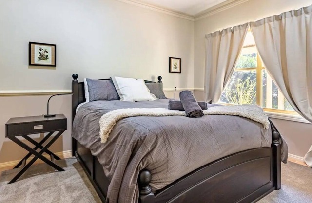 This 4BR French, country-style homestead offers the rural getaway !