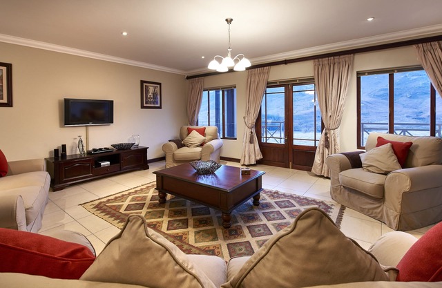 This holiday home has a balcony, stove top and kitchen