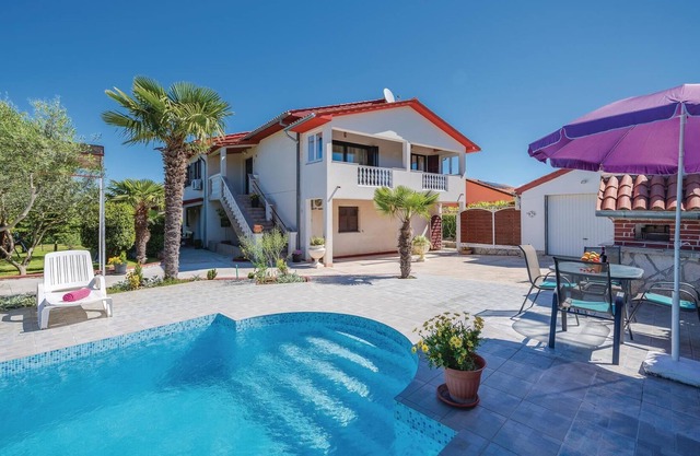 This Mediterranean vacation home with pool and beautifully landscaped garden is located in a settlem