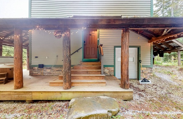 Three-level dog-friendly getaway with a private hot tub, fireplace, & W/D