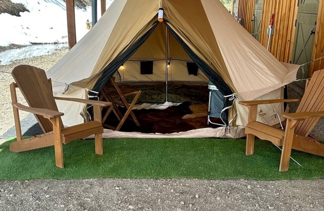Traditional Tent with Countryside Sunrise View