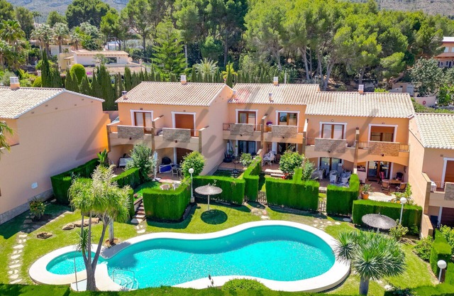 Two bedroom terrace house with stunning communal pool and gardens