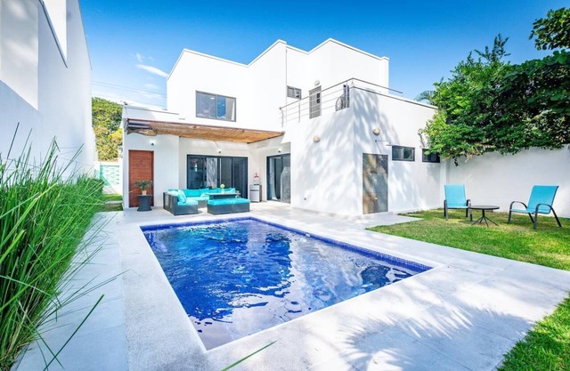 Ultramodern Townhome with an Inviting Coastal Design and Lush Outdoor Oasis with a Private Pool