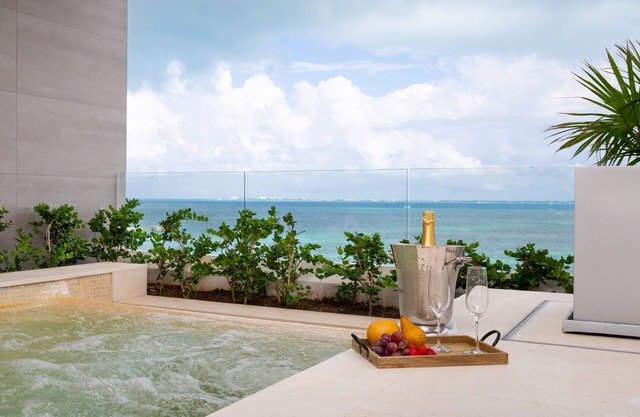 Unwrap Tropical Bliss: Experience Holiday Luxury in 3-Bedroom Ocean Front Oasis!