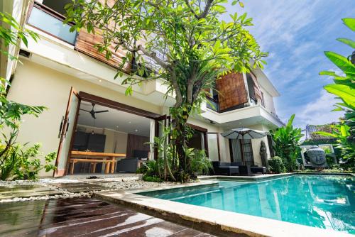 Villa Tepi Sungai a luxurious, under new management, 6 bedroom 620 sqm retreat featuring a stunning 15 meter pool and dedicated childrens room with 4 bunk beds newly renovated in Seminyak