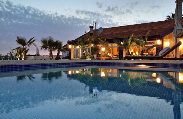 Villa with pool, terrace and private garden on the beach