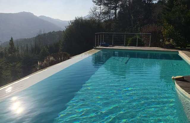 Villa with salty infinity pool and view over hills on French Riviera