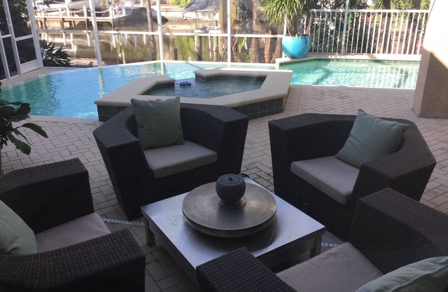 Walk or bike to the beach from this bright, airy 4BR waterfront home in Naples