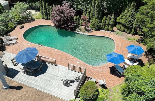 Walk to a beach or enjoy the spacious pool framed by nature sanctuary