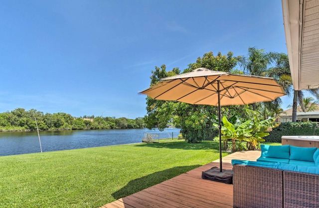 Water-view home near the beach with private hot tub, deck, boat access, grill