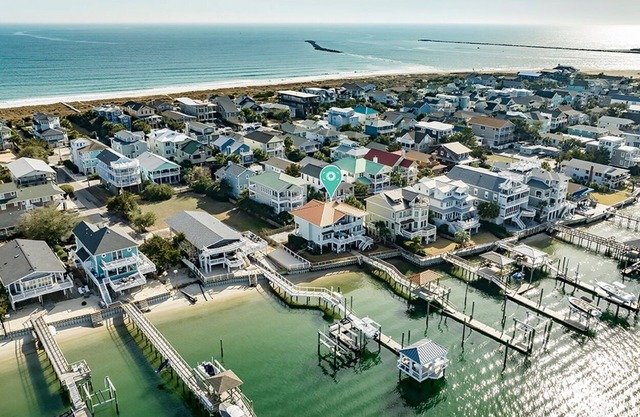 Waterfront 5 BR home w/incredible views, dock, boat slips, & elevator!