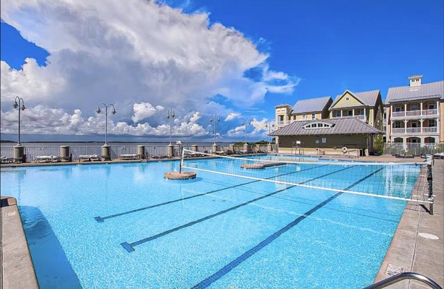 Waterfront condo with balcony, fireplace, AC, W/D, WiFi, indoor & outdoor pools