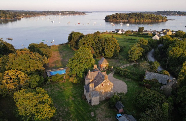 Waterfront manor house with heated pool