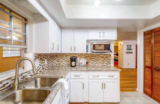 Welcoming dog-friendly Florida home with enclosed yard, patio, and central AC