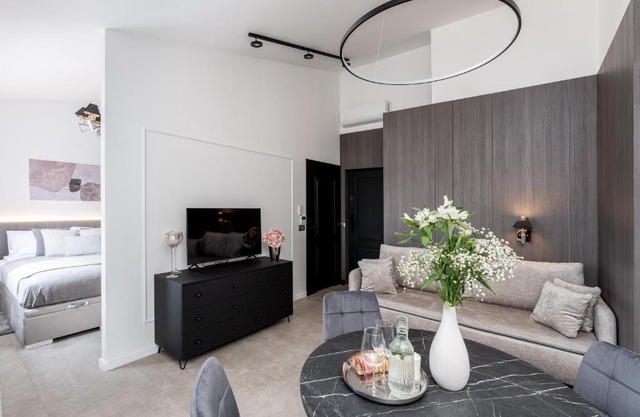 Wielopole Top Floor Apartments by Hostly