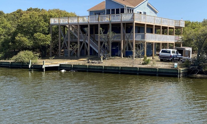 Carova Beach House | 2 Free beach parking passes! Waterfront Hot Tub Boat dock Pet friendly 360 Decks