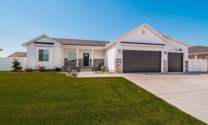 Idaho Falls House | 6 bed 3 bath home ~ sleeps 20! w/game room, fireplace, hot tub & playground.