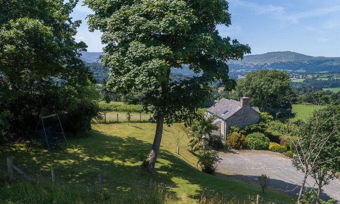 Eglwysbach Cottage | A bedroom, a cabin bedroom, bathroom. Sleeps two guests plus one child. Parking.