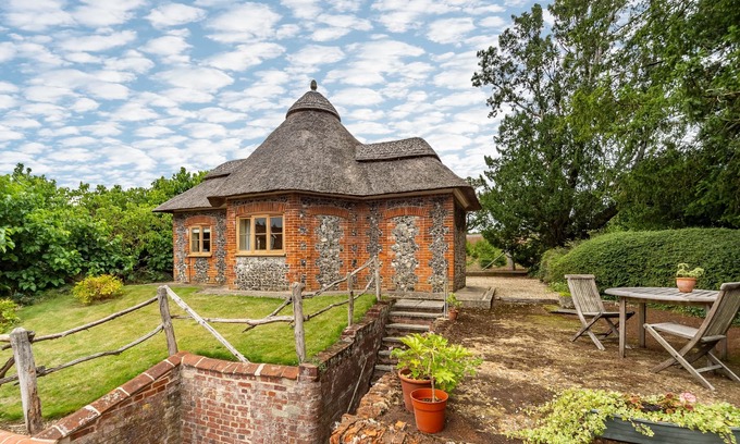 East Tuddenham Apartment | A unique octagonal brick and flint thatched Victorian cottage nestling in a tranquil village locatio