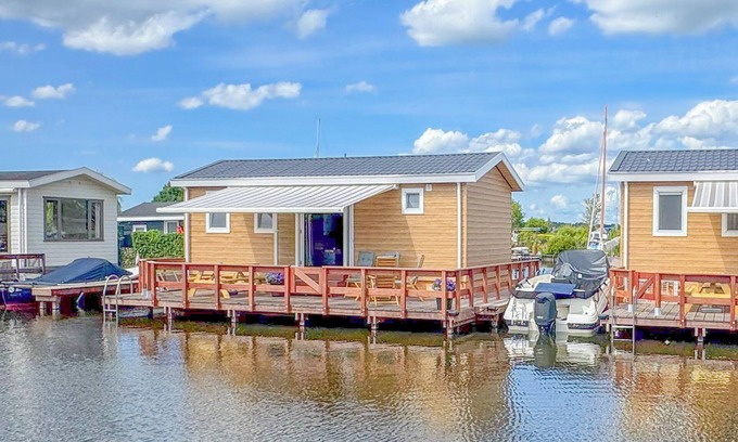 Municipality of Stichtse Vecht Boat Rental | Air-conditioned chalet with waterside terrace