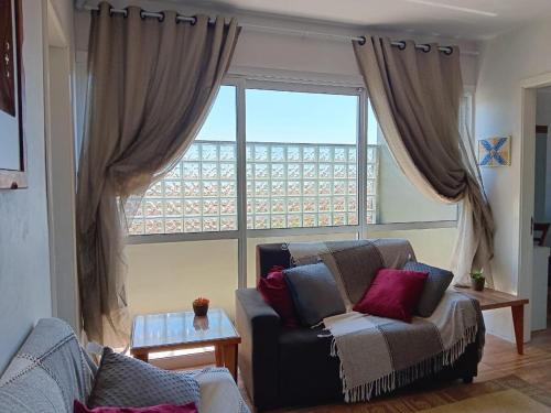 Passo de Torres Apartment | Apartment 2 blocks from the sea with parking and Wi-Fi