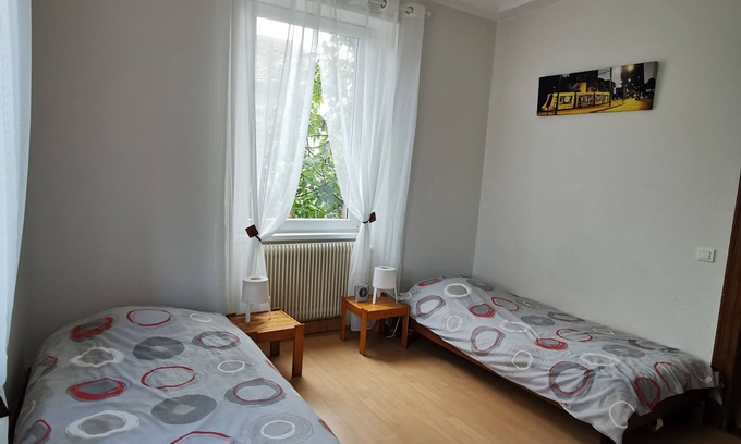 Mulhouse Apartment | Apartment in house, from 2 to 4 people, 2 bedrooms, garden.