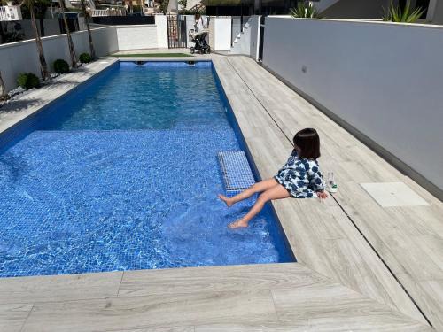 Santiago de la Ribera Apartment | Beach bungalow with swiming pool and long terrace