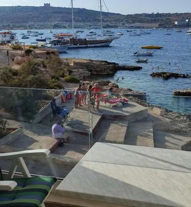 Għadira Apartment | BEACHFRONT with Seaviews Apartment No56 Award Winner Unbeatable Location for Closeness to the Sea Ideal for Guests looking for Winter Spring and Autumn Breaks in Sunny Malta Also Ideal for Coastal Hikers
