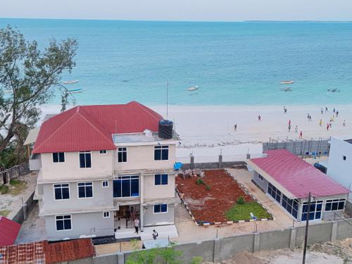 Uroa Apartment | Beachfront Zanzibar Escape 2BR Suites with Balcony WiFi, Uroa