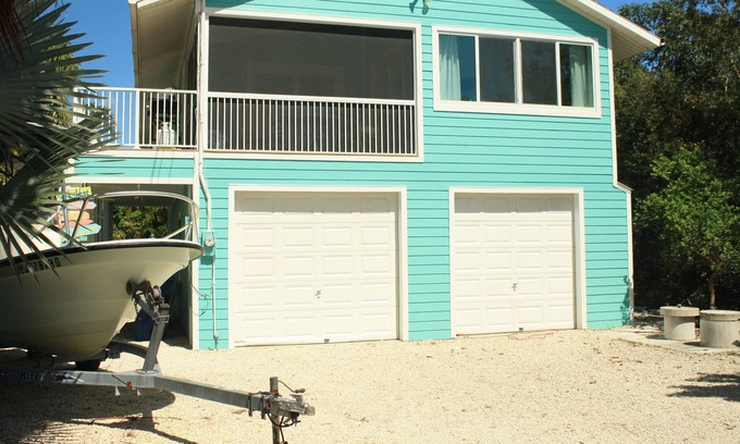 Breezeswept Beach Estates House | Beautiful 3 bedroom 2 bath canal front home with excellent boating!!